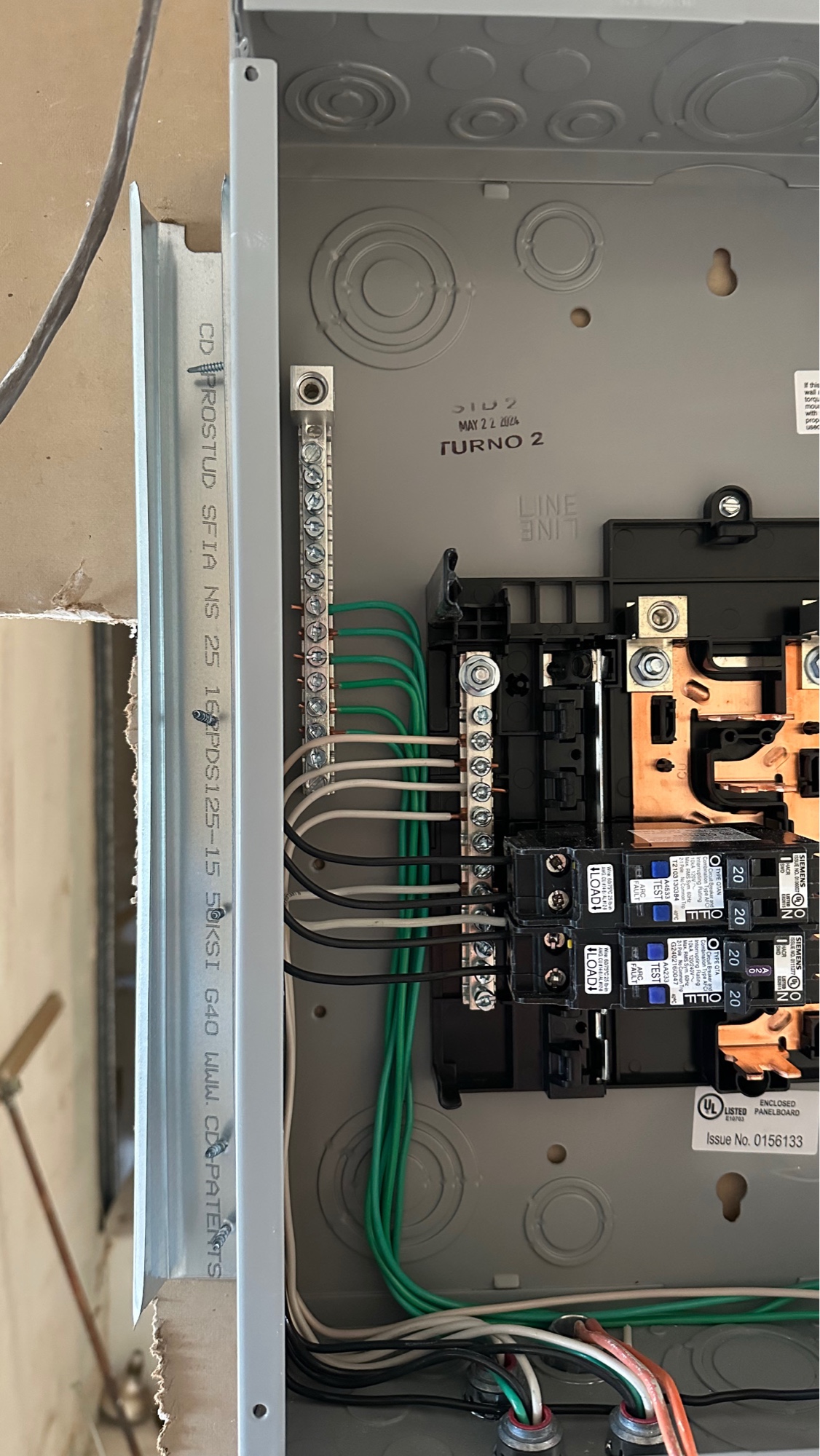 Clean, code-compliant electrical panel upgrade — organized wiring, labeled circuits, professional finish